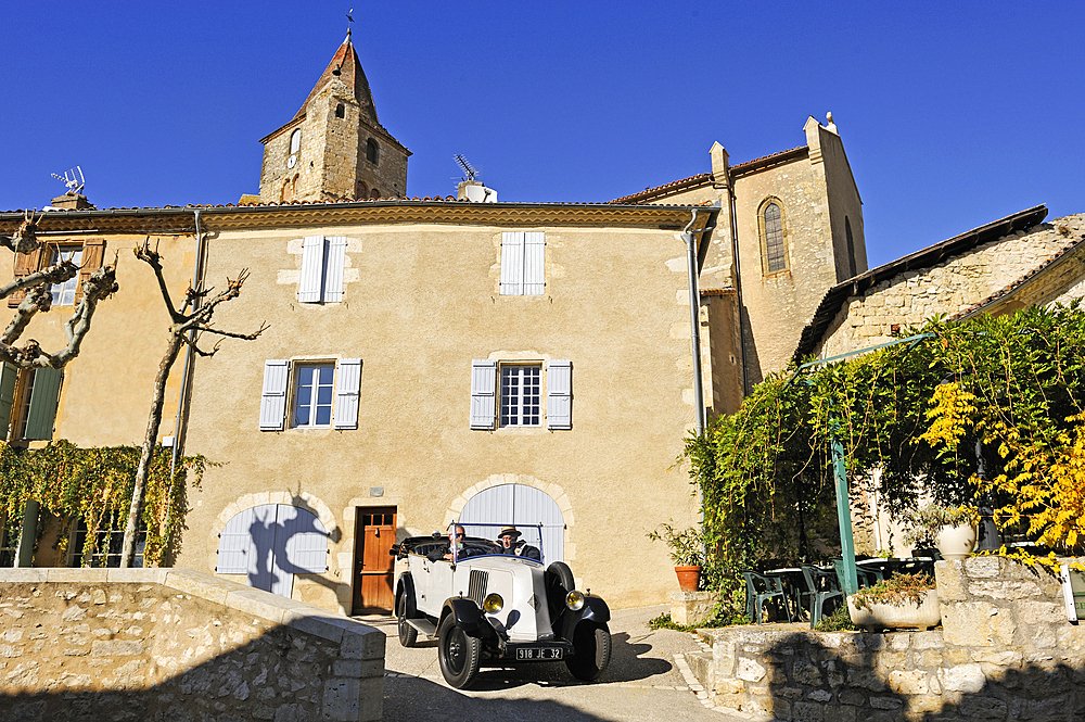 Drive with an open touring vintage car (Renault of 1925) at Lavardens,Gers department, Occitanie region, southwest of France,Europe