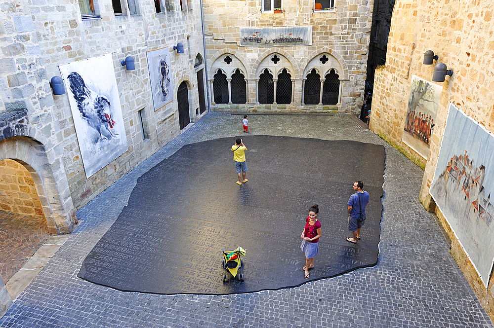 Giant copy of the Rosetta stone, sculpted in granit by the American conceptual artist Joseph Kosuth, on the 'Place des Ecritures' (writings Place) in the city of Figeac, Lot department, region of Midi-Pyrenees, Occitanie, southwest of France, Europe