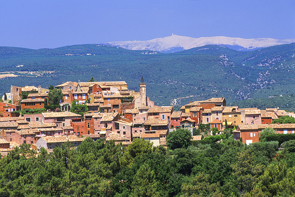 Roussillon one of the most beautiful villages of France with the Mont Ventoux in background, Luberon Massif,Vaucluse department,Provence-Alpes-Cote d'Azur region,southeast of France,Europe
