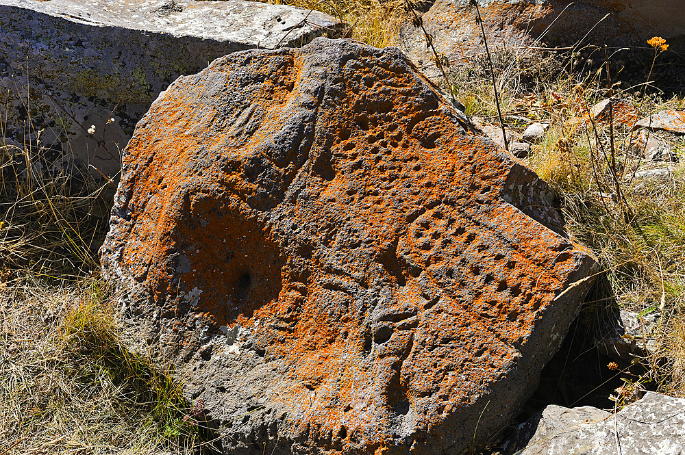 Petroglyphs on rock of Argitchi plateau, Gegharkunik region, Armenia, Eurasia