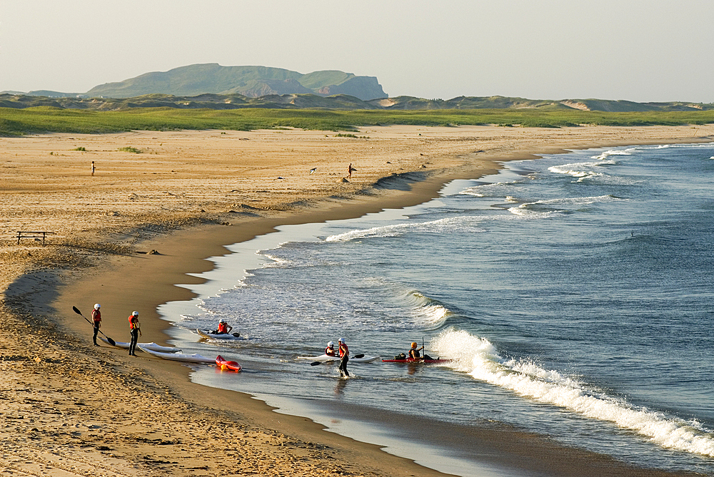 Kayakers in a bay La Grosse Ile, Magdalen Islands, Gulf of Saint Lawrence, Quebec province, Canada, North America