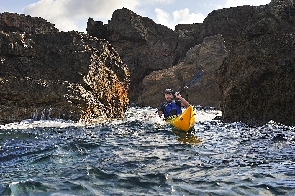 Kayaker near Cape Cavalleria on the North Coast of Menorca, Balearic Islands, Spain, Mediterranean, Europe