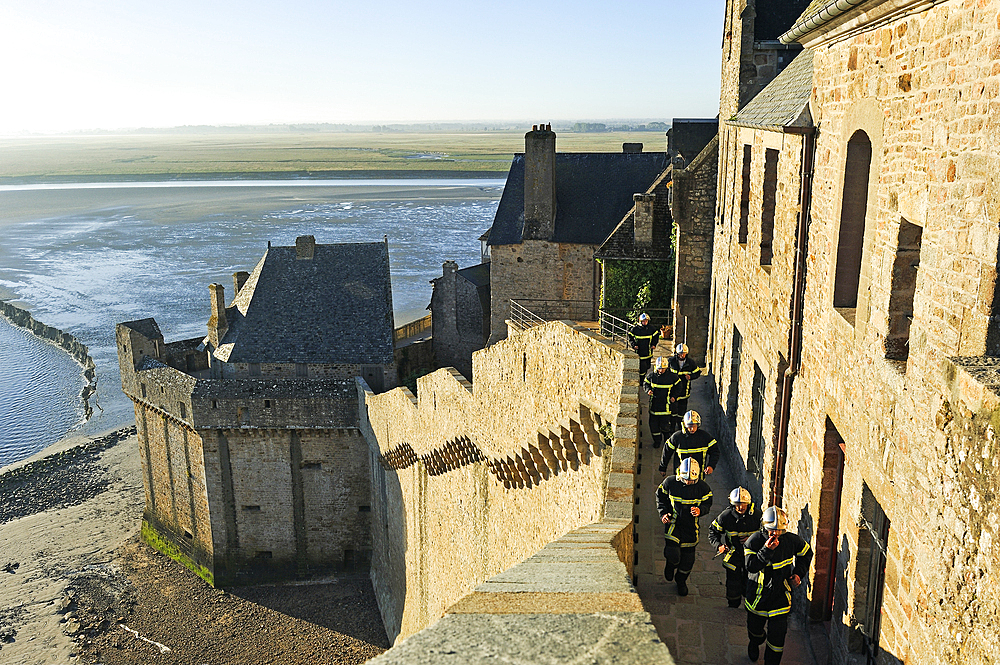 Firemen in training on the ramparts of Mont-Saint-Michel, Manche department, Normandy region, France, Europe