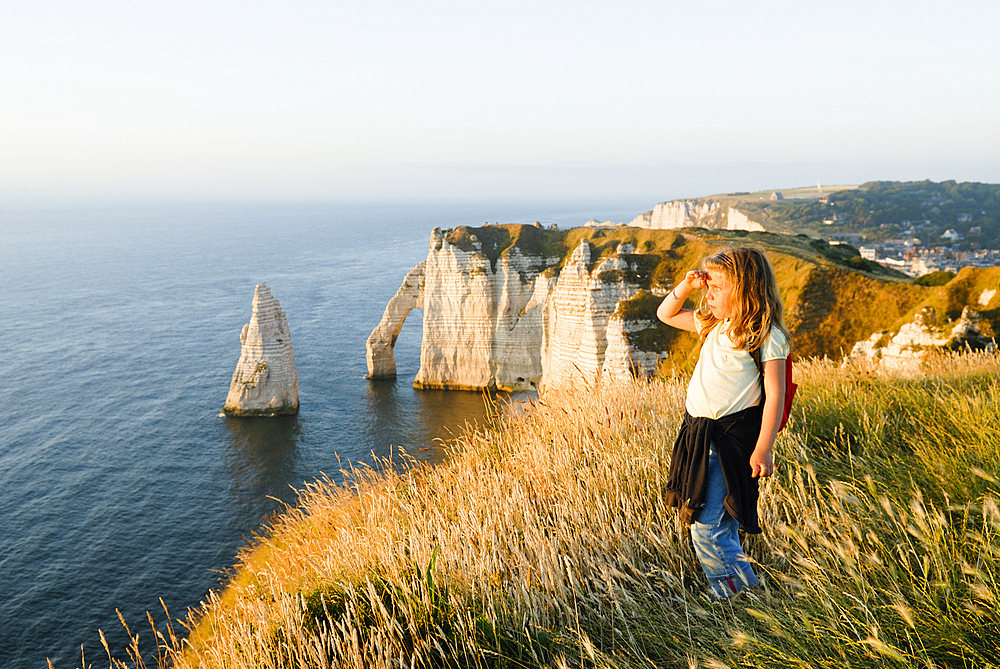 Little girl on the top of cliff, Etretat, Cote d'Albatre, Pays de Caux, Seine-Maritime department, Upper Normandy region, France, Europe