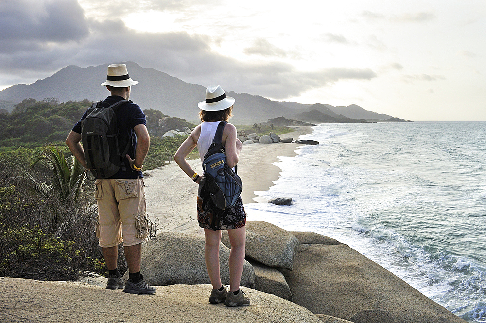 Woman and man admiring the beaches of Arrecifes, Tayrona National Natural Park, Department of Magdalena, Caribbean Region, Colombia, South America