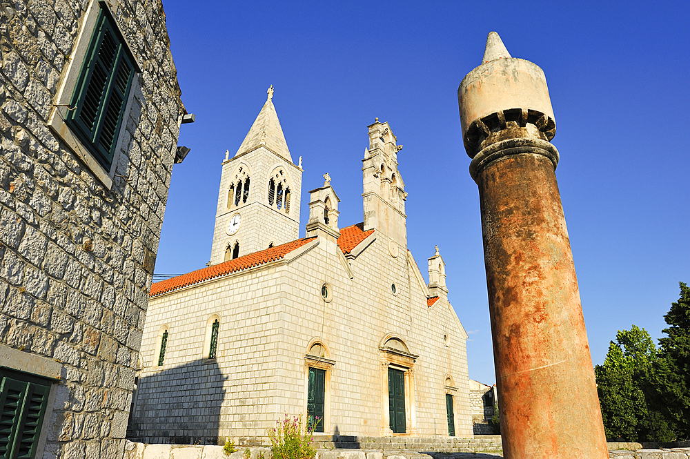 Typical chimney in front of the church of Saint Cosmas and Saint Damian dating from the 14th century, Lastovo town, Lastovo island, Croatia, Southeast Europe