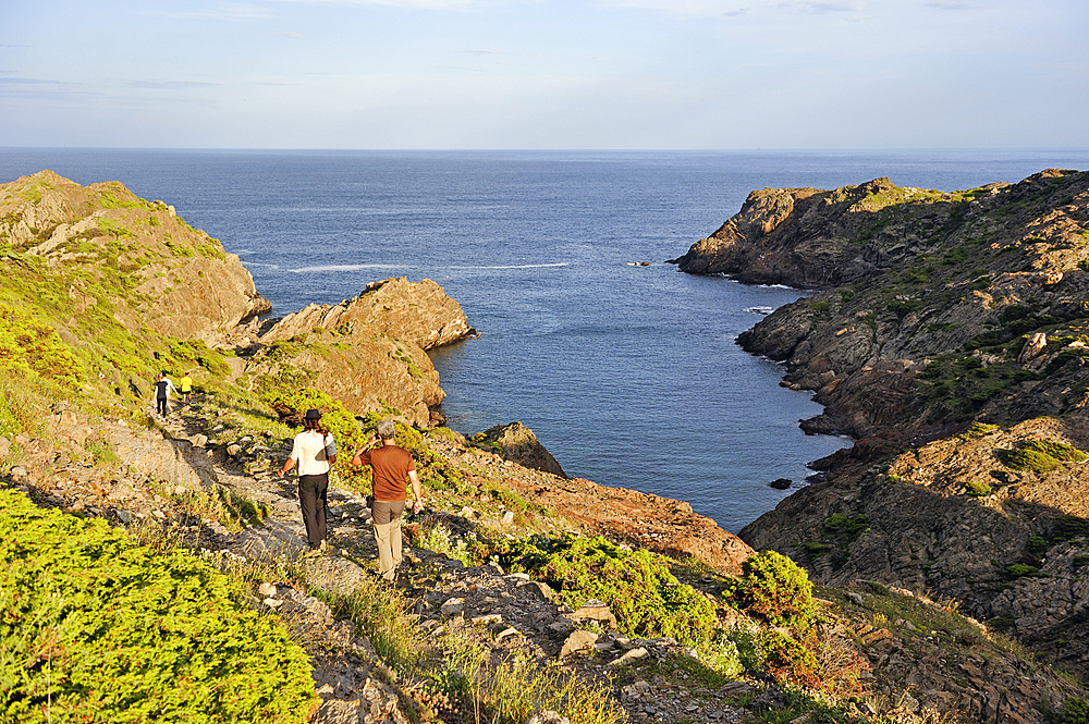 Hikers at Cala Fredosa creek, Cap Creus, Costa Brava, Catalonia, Spain, Europe