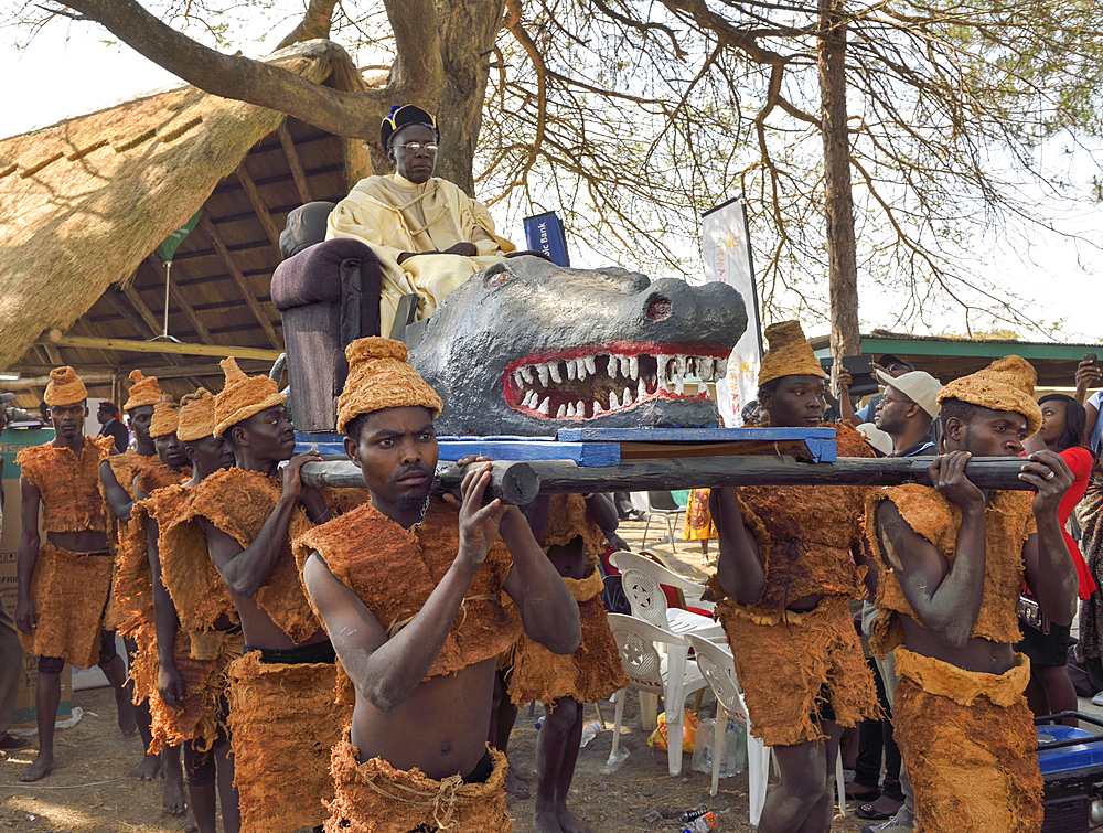 Paramount Chief Chitimukulu arriving to start the Ukusefya Pa Ng'wena Ceremony riding on his crocodile chair, Kasama, Zambia, Africa