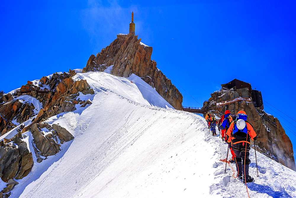 Mountaineers climbing the Aiguille du Midi (Mont Blanc), France.