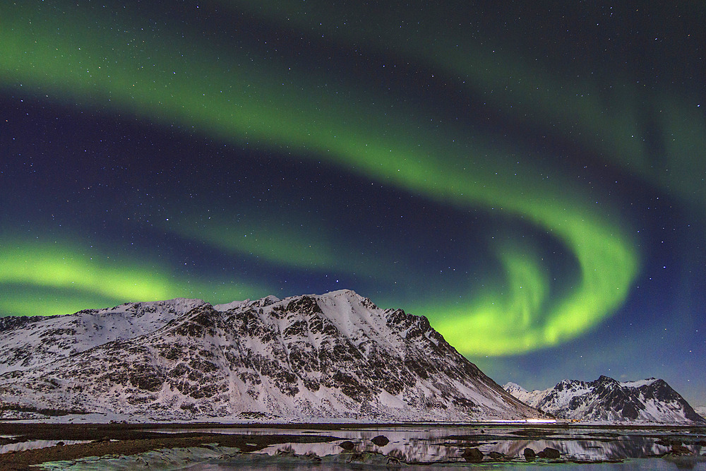Northern lights over Stamsund fjord (Lofoten Islands), Norway.