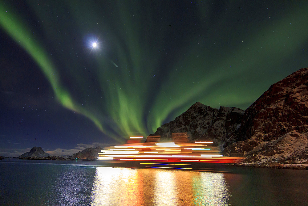 Hurtigruten postal ship with northern lights., Norway.