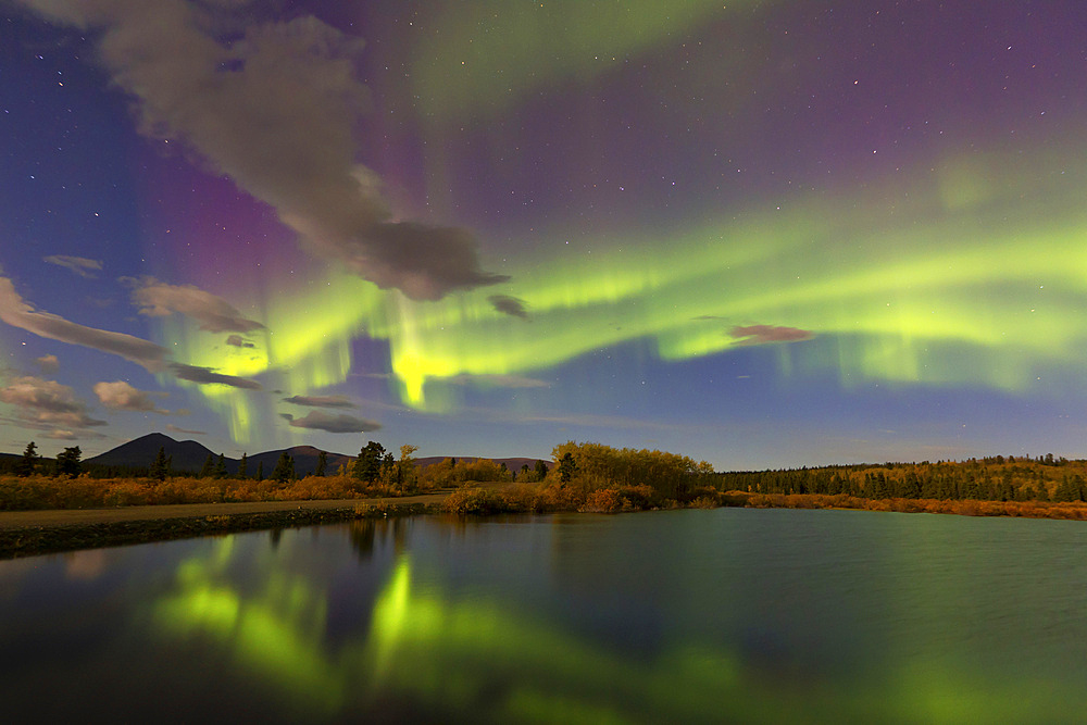 Aurora borealis with moonlight at Fish Lake, Whitehorse, Yukon, Canada.