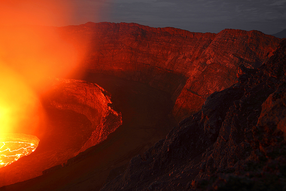 January 21, 2011 - Nighttime view of summit caldera with lava lake, Nyiragongo Volcano, Democratic Republic Congo.