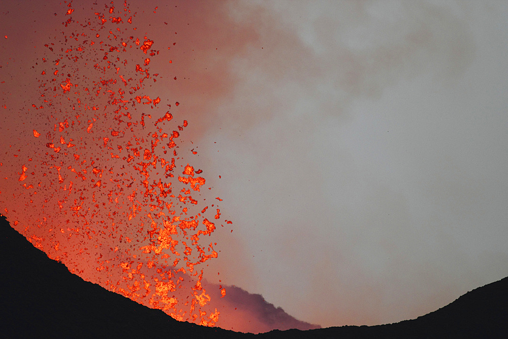 January 23, 2012 - Incandescent lava bombs expelled during a basaltic fissure eruption on Nyamuragira Volcano, Kimanura Eruption.