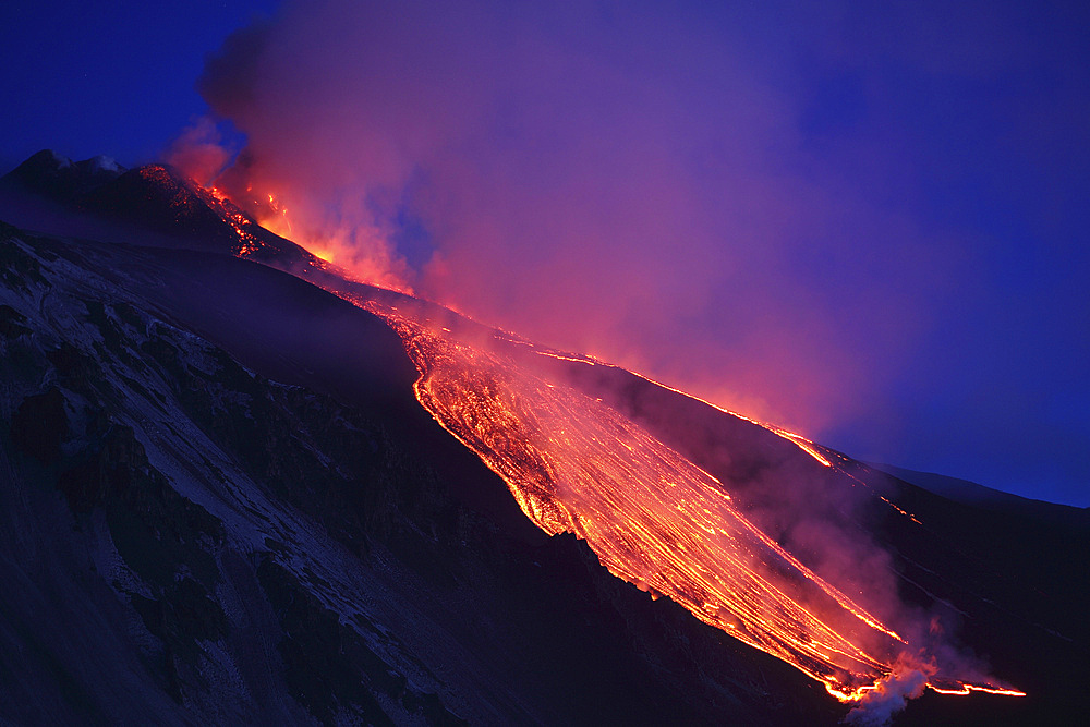 April 1, 2012 - Lava flowing into Valle del Bove at Mount Etna Volcano, Italy, following paroxysmal eruption.