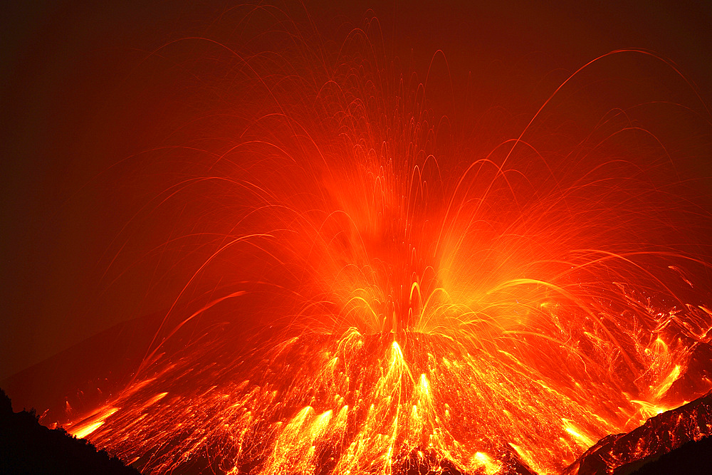 February 23, 2013 - Powerful night time explosive eruption of Sakurajima volcano, Japan. Trajectories of glowing incandescent volcanic bombs are visible.