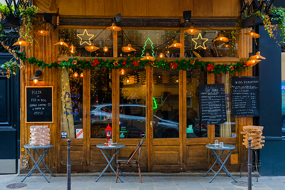 Christmas decorations at a pizza restaurant in Paris, France