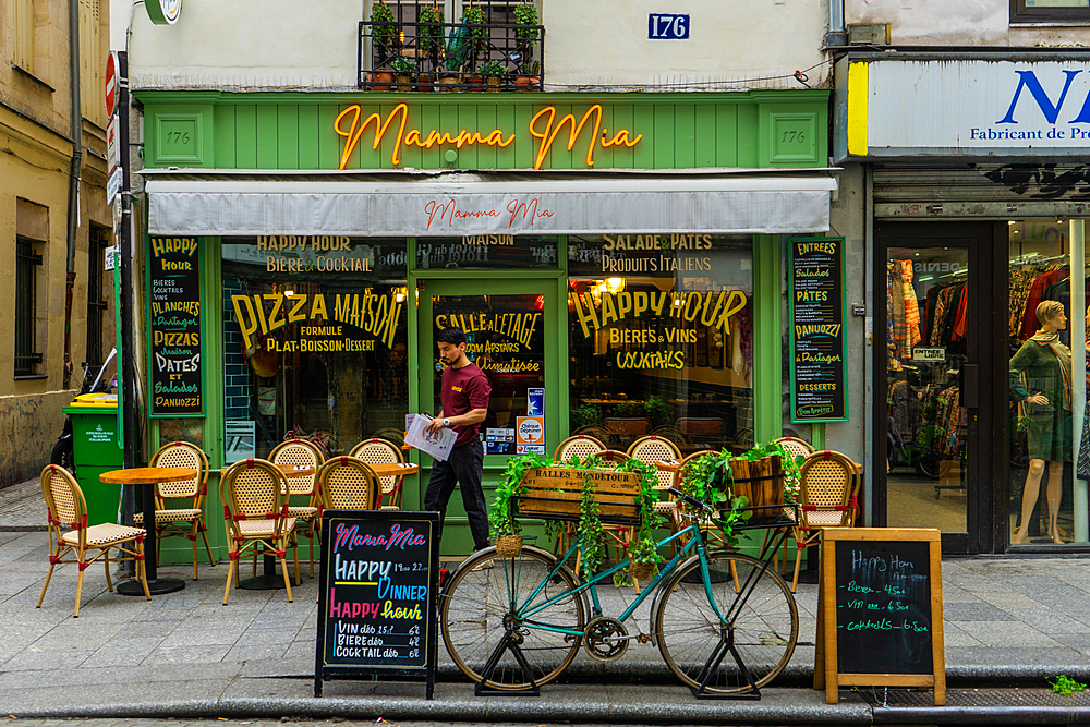 Waiter at Mamma Mia pizza restaurant on Rue Saint-Denis, Paris, France