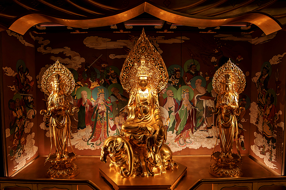 Exquisite Buddha statues in Wanfo (ten thousand Buddha) Pagoda (reconstructed 2014), Jinhua City, Zhejiang Province, China. First built between 907-978 A.D., the pagoda was destroyed several times in history. It houses a wealth of Buddhists relics.