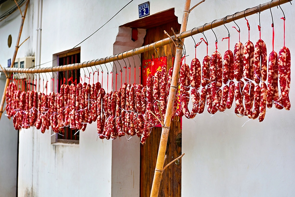 Sausages air dried at Zhuge Bagua village, Lanxi County, Jinhua, Zhejiang Province, China. The 600 year old village, based on Bagua layout, live the descendants of Zhuge Liang (Three Kingdoms era).The village buildings existed since the Ming Dynasty.