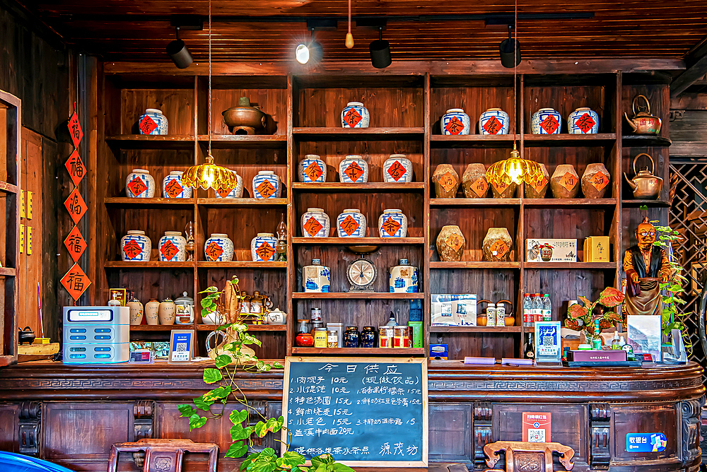 Shelves stack with tea and wine, Youbu Old Town, Lanxi County, Jinhua City, Zhejiang, China. Located at the intersection of 4 provinces, merchants have gathered here since the Ming Dynasty and is renowned for its 5a.m. morning tea (breakfast) culture.