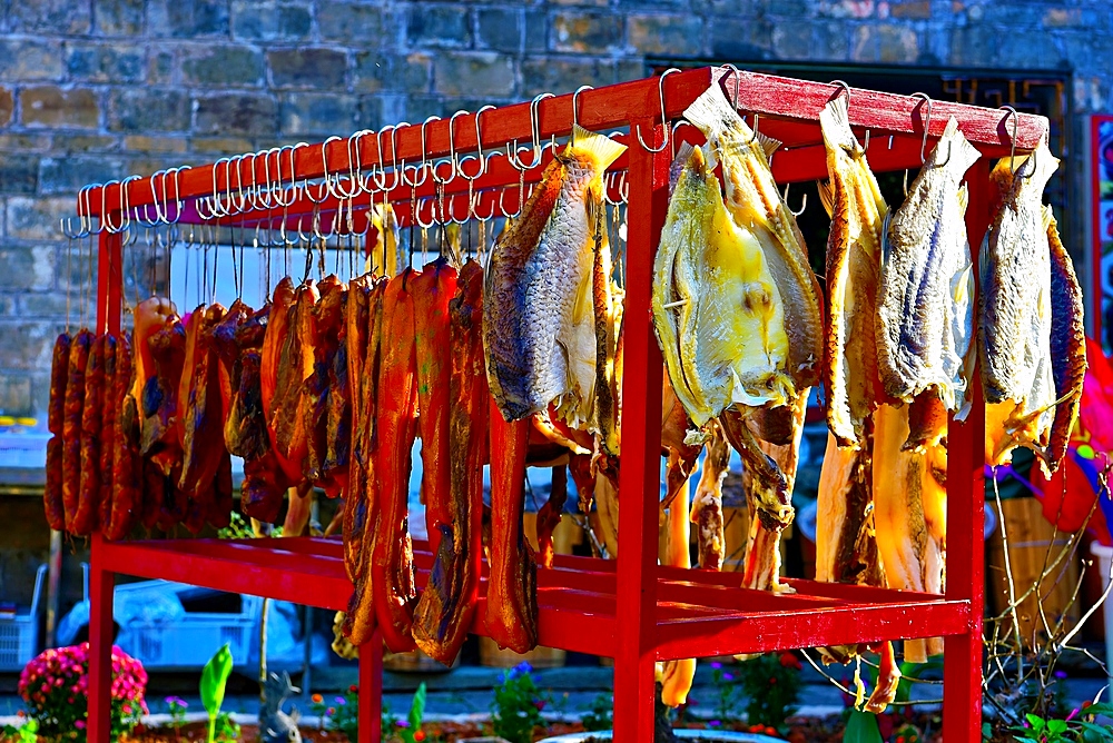 Cured fish, meat and sausages being air dried at Yaoli ancient village, Jingdezhen, Jiangxi Province, China. This 2000 year old village has more than 250 heritage buildings from the Ming and Qing era.