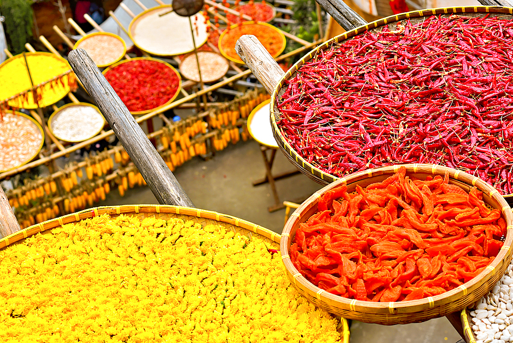 Chillies, corn and other produce being sun dried in autumn, Huangling, Wuyuan County, Shangrao City, Jiangxi Province, China. Huangling is an ancient village that dates back to the Ming Dynasty more than 500 years ago and is known for its natural beauty.