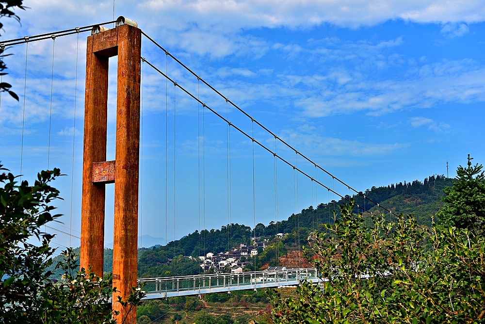 Suspension bridge leading into Huangling ancient village in Wuyuan County, Shangrao City, Jiangxi Province, China. The village dates back to the Ming Dynasty more than 500 years ago and is known for its natural beauty.