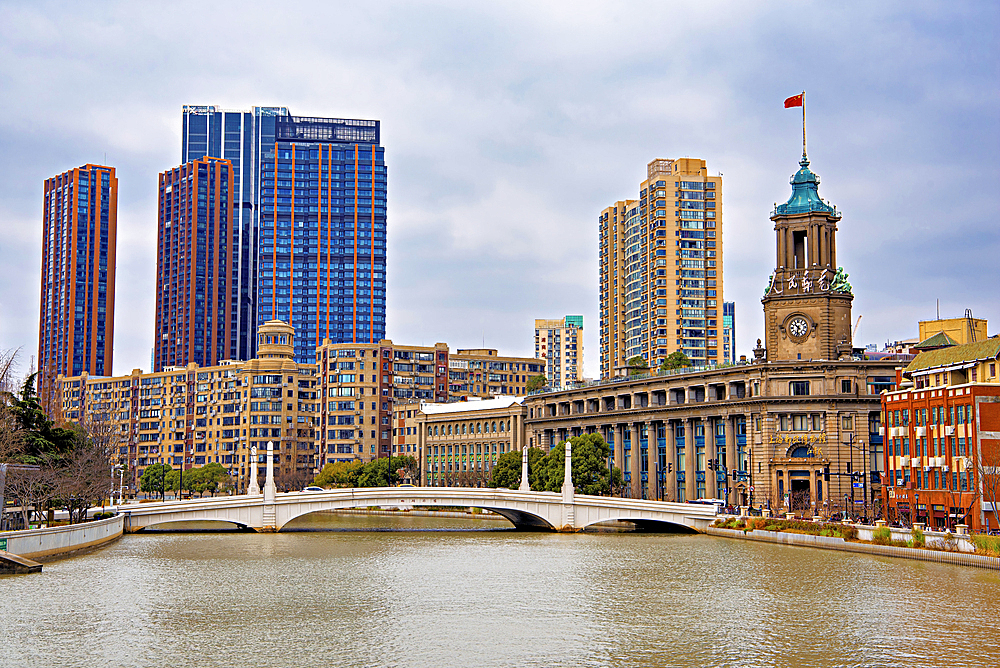 Suzhou Creek with the Shanghai Postal Museum (built in the 1920s) on the right, Shanghai, China