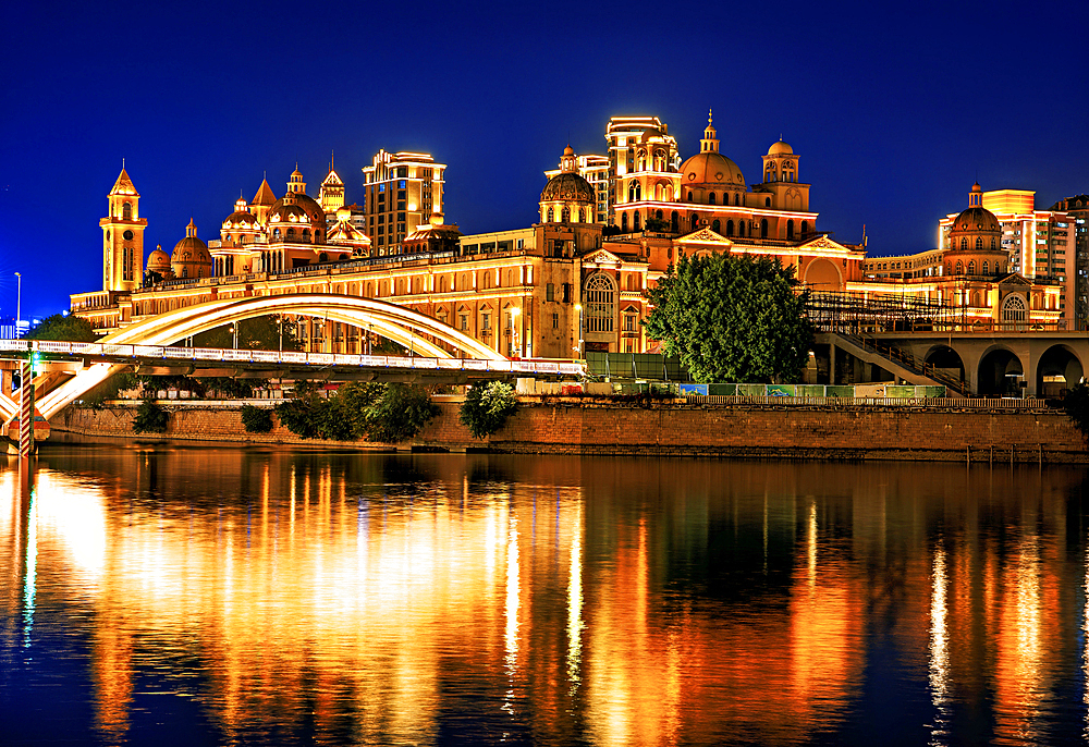 ZhongZhou Island with its European style heritage buildings built in the late 19th century connected by JieFang (Liberation) Bridge over the Minjiang River at night. Fuzhou, Fujian Province, China.