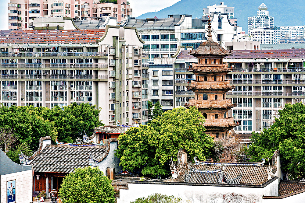 Fuzhou city view with the 'Wu' (dark) pagoda, Fuzhou, Fujian Province, China. The pagoda was first built in 799 AD (rebuilt 941 AD).