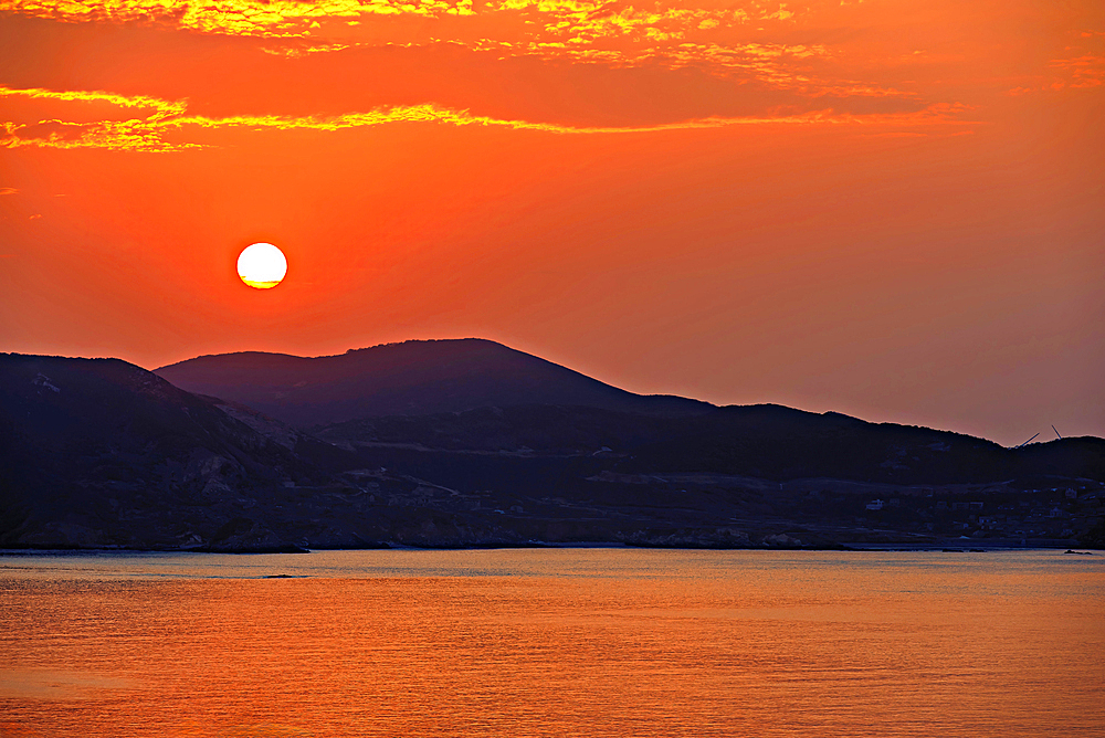 Golden sunset over the hills and the sea of Pingtan Island, Fuzhou City, Fujian Province, China.