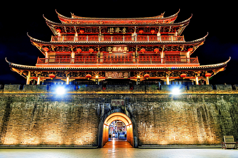 Guangji Gate Tower at night, built in 1370, the gate leads into Chaozhou ancient city, Paifang street, Chaozhou City, Guangdong Province, China
