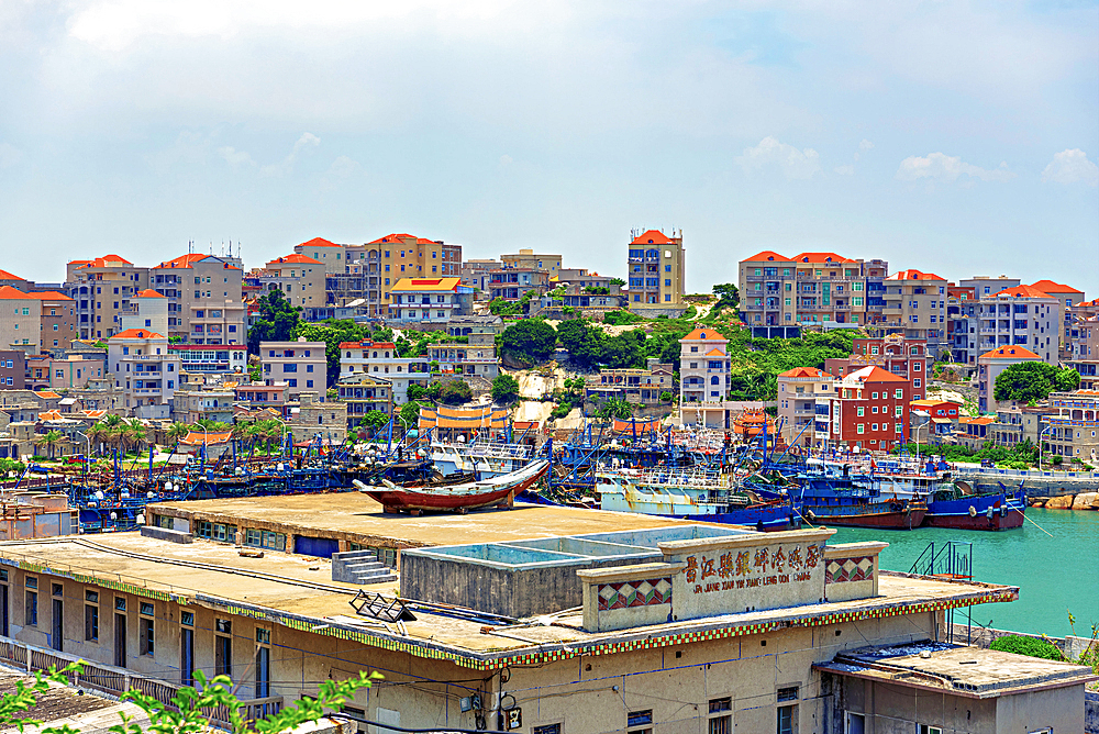 Fishing boats and trawlers at the bay in Little Weihai, a picturesque seaside fishing town in Shishi, Quanzhou, Fujian Province, China