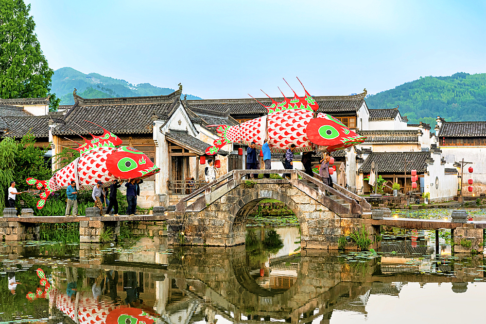 Village parade of giant fish lanterns, Chengkan Ancient Village, Huangshan City, Anhui, China. The village was established 1800 years ago by the Luo family clan. It has buildings dating as early as the Song Dynasty (960 to 1279 AD).
