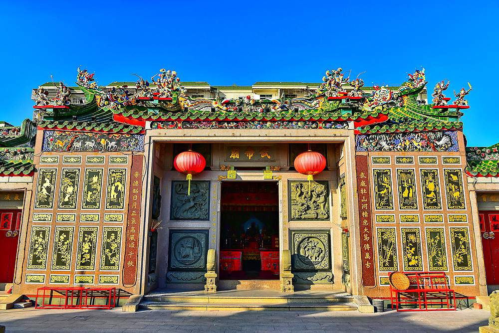 Wu'di temple on Nan'ao Island, Shantou City, Guangdong Province, China. The temple worships the God of War, Guanyu of the Three Kingdoms. Note the intricate porcelain inlay sculptures on the rooftop, a unique cultural heritage artform of the region.