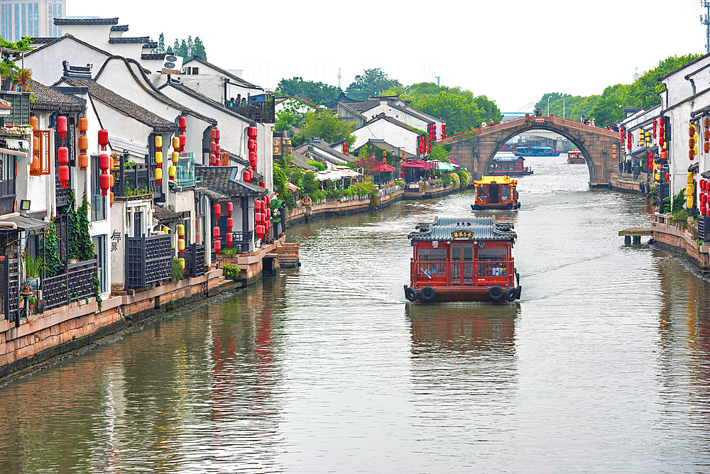 Water taxis in Wuxi City, Jiangsu, China. Multiple rivers run through the city which is common feature of some cities in this region that also include Suzhou.