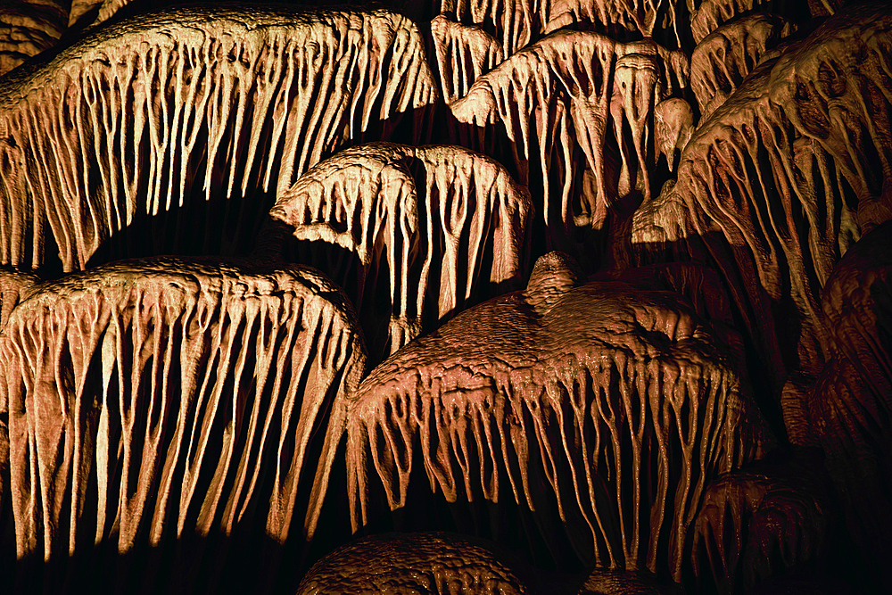 Background with Stalactites and stalagmites in the Sorek Cave in Israel