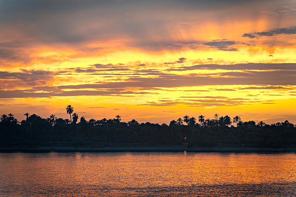 Fiery sky at sunset, Nile River, Egypt