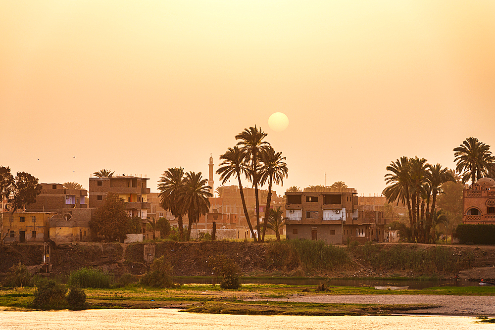 Egyptian village on banks of Nile River, Egypt