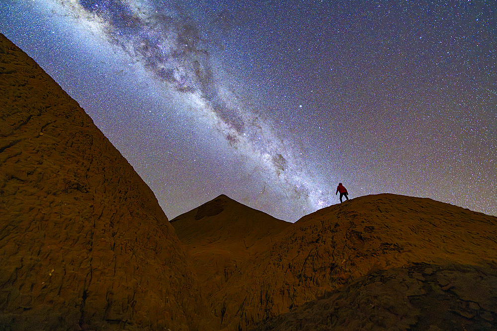 Man looking at the Milky Way, Devil's Desert, Puna, Salta, Argentina