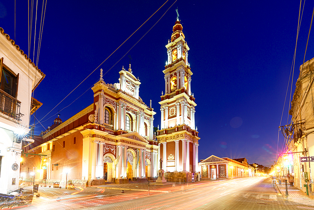 Lights of car trails at dusk on an empty road near Saint Francis church, Salta, Argentina