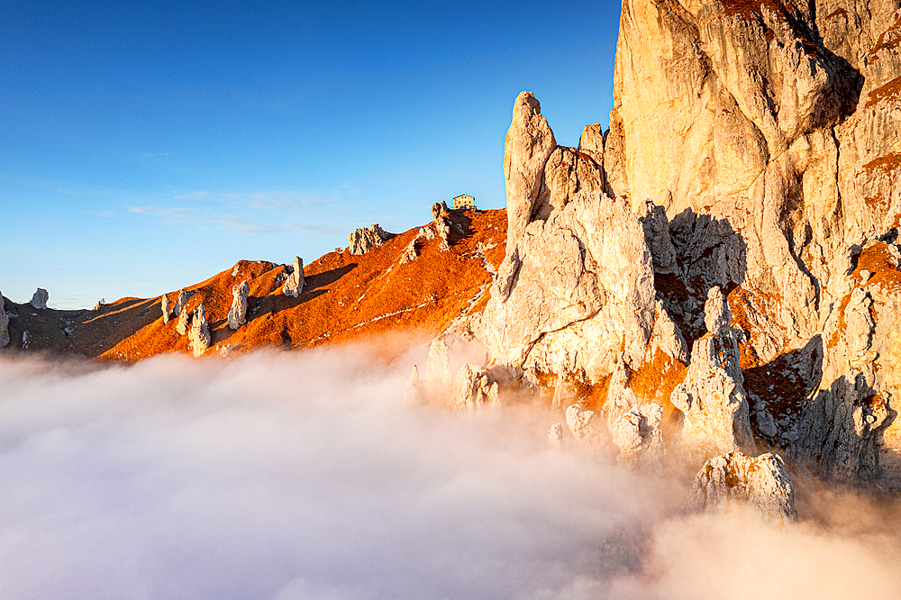 Rifugio Rosalba and Grignetta (Grigna Meridionale) in autumn fog, Lake Como, Lombardy, Italy