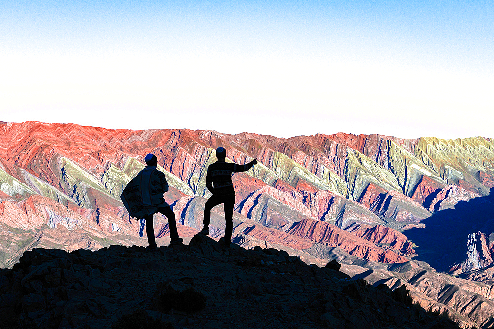 Silhouette of tourists at sunset, Serrania de Hornocal, Humahuaca, Jujuy, Argentina