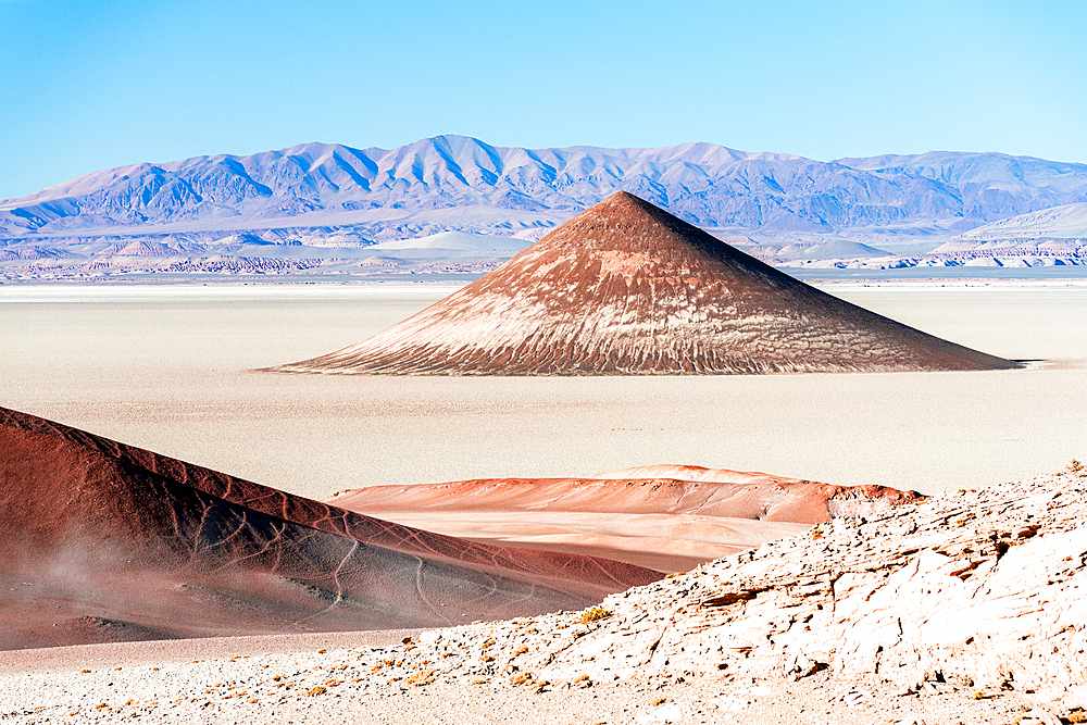 Surreal Arita Cone natural formation (Cono De Arita) at sunset, Salar de Arizaro salt flat, Puna, Argentina