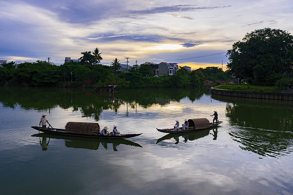 Women on traditional boats along Nhu Y River, Hue, Central Vietnam. (MR)