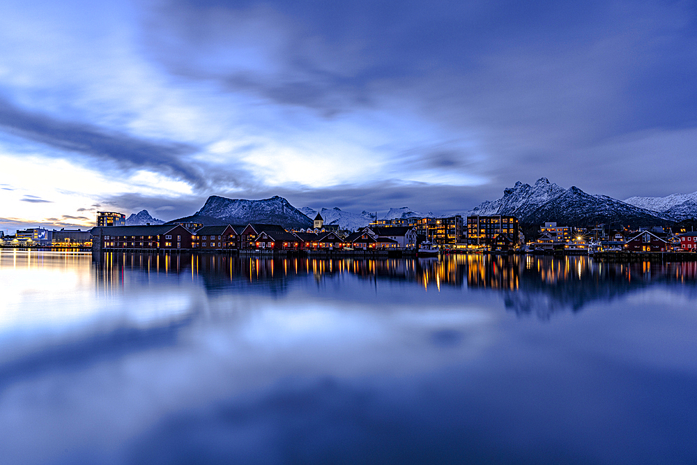 Svolvaer town reflected in the sea at dusk, Vagan, Nordland, Lofoten Islands, Norway