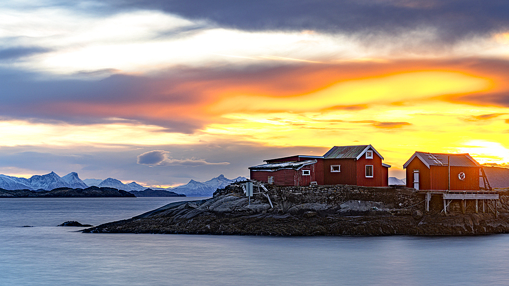 Golden sunrise over rorbu cabins, Svolvaer, Vagan, Nordland, Lofoten Islands, Norway