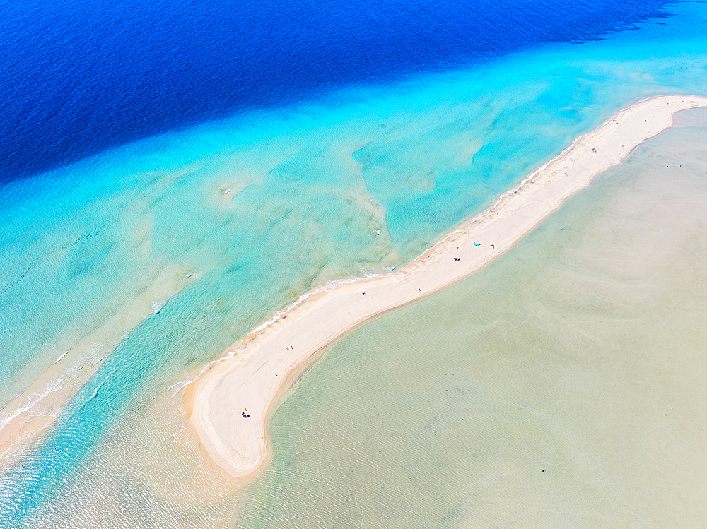 Blue and turquoise shades of sea washing the white sand of Sotavento beach, aerial view, Fuerteventura, Canary Islands, Spain