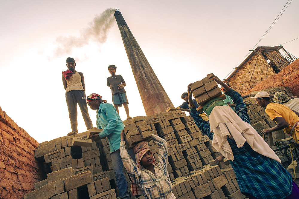 Women labourers working in a brick factory in Assam, India